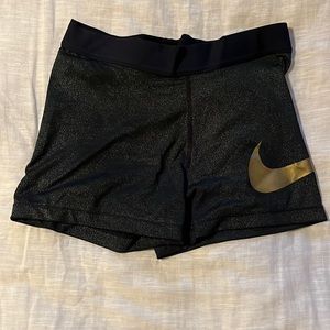 Nike black and gold spandex shorts